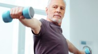 Aging man doing bicep exercises to reverse physical decline