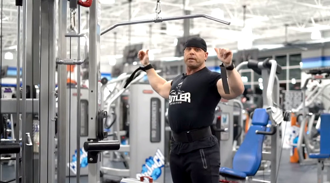 David Baye showing how to properly perform a wide grip late pulldown exercise for your upper body and back workout routine