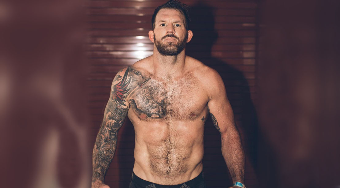 MMA Fighter and Bellator Heavyweight champ Ryan Bader showing off his muscular physique