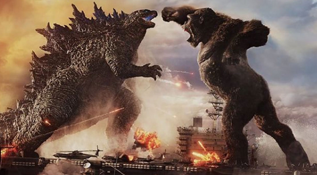Godzilla Vs King Kong fighting on a military base