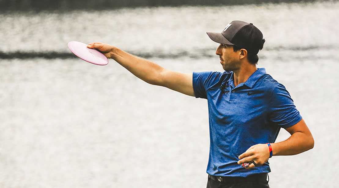 Paul McBeth throwing a frisbee and playing disc golf