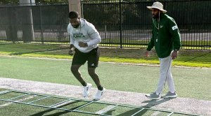 University of South Florida’s Director of Football Strength and Conditioning AJ Artis Coaching An Athlete On Improving Agility with a Footwork Ladder Drill