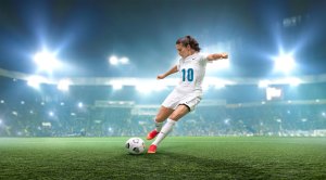 Carli Lloyd shooting a soccer ball and penalty kick with