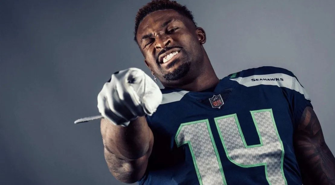 DK Metcalf in his Seattle Seahawks football uniform pointing