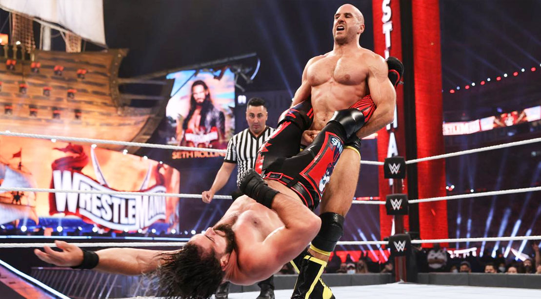 WWE wrestler ‘Swiss Cyborg’ Cesaro performing a pro-wrestling move on WWE wrestler Roman Reigns