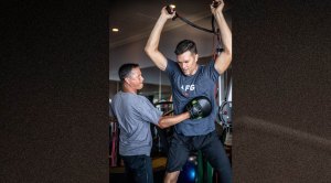 Alex Guerrero training NFL quarterback Tom Brady with boxing mitts