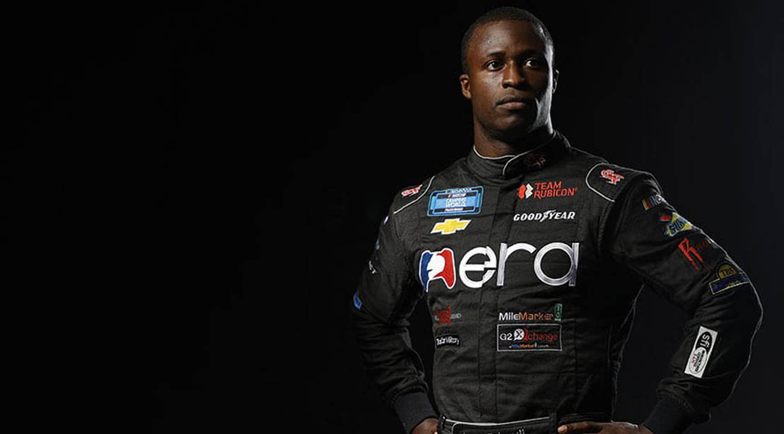 Nascar driver Jessie Iwuji wearing his racing uniform
