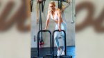 Charlotte Flair posing in her gym and workout clothing