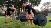 Soldier Chris Kellum perofrming a deadlift for his Posterior Chain Workout and shoulder domination workout routine and high volume superset routine