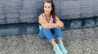 Olympic gymnast Aly Raisman sitting on roof dealing with her migraine