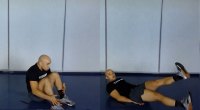 UFC and MMA Fighter Marlon Moraes performing core exercises for Round 3 of his MMA Workout