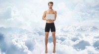 Man working on his laptop and floating in the sky while wearing jetsetter boxer brief