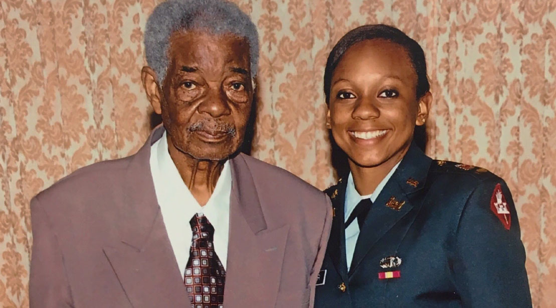 Service Woman and female bodybuilder Julia Waring in uniform with her father