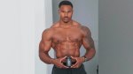 Fitness professional Simeon Panda holding a bottle of T-Drive by Inno Supps