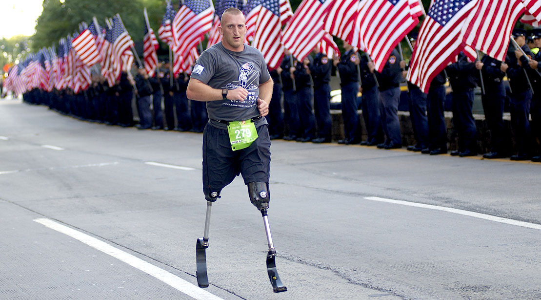 Military veteran Rob Jones running a race using running prosthetic legs
