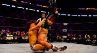 Prowrestler for AEW Bryan Danielson performing a pile driver on his wrestling opponent