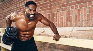 Actor LaMonica Garrett showing his impressive physique at age 46 and performing a single arm dumbbell row