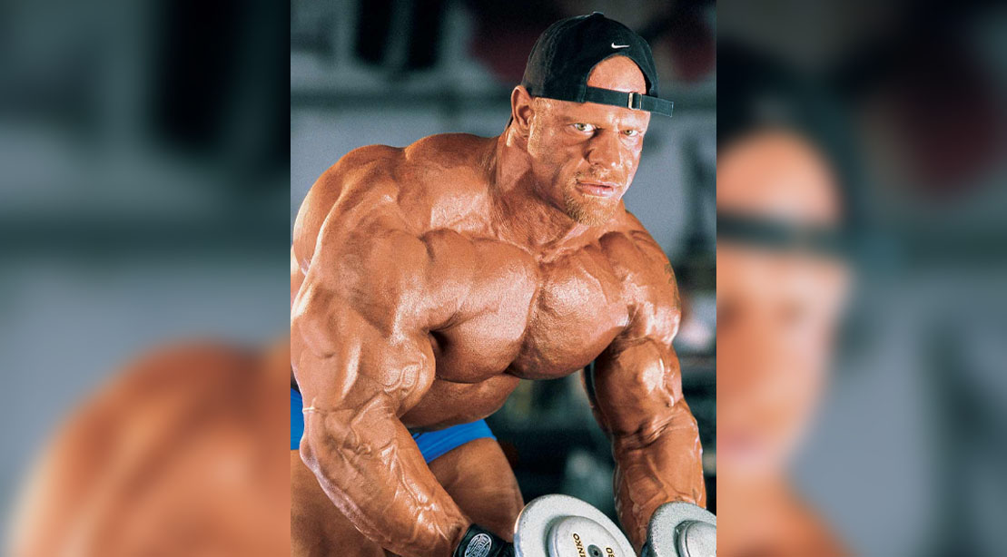 Bodybuilder Tom Prince performing a dumbbell workout