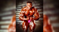 Bodybuilder Victor Richards posing in pink trunks