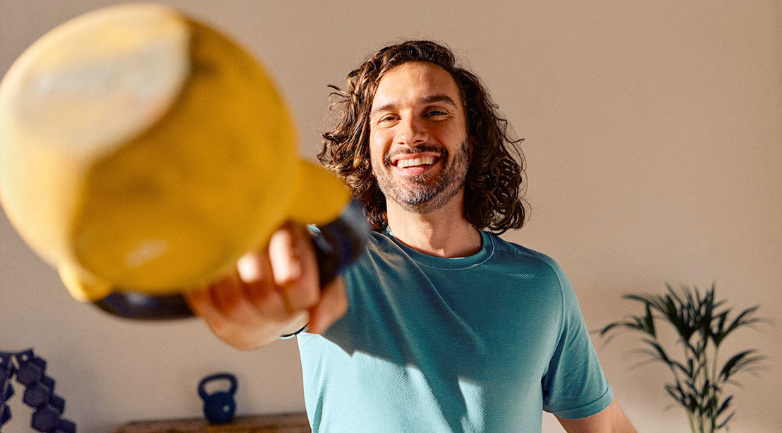 British celebrity trainer Joe Wicks performing a kettlebell swing and giving tips on how to cut calories