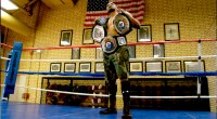 Marine veteran Ironbound Mike Steadman holding 3 national boxing championship belts
