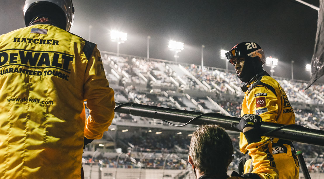 Derrell Edwards as a Nascar Pit Crew Member anticipitating a change in a nascar race