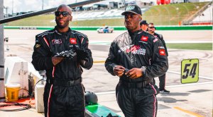 Derrell Edwards watching Nascar racers as a Nascar Pit Crew Member