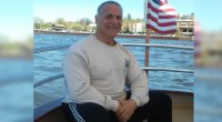 bodybuilder and police officer Joe Palumbo on a boat