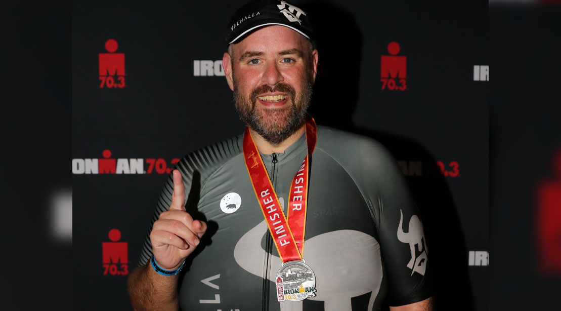 Jeff Cottrell wearing his ironman finisher medal