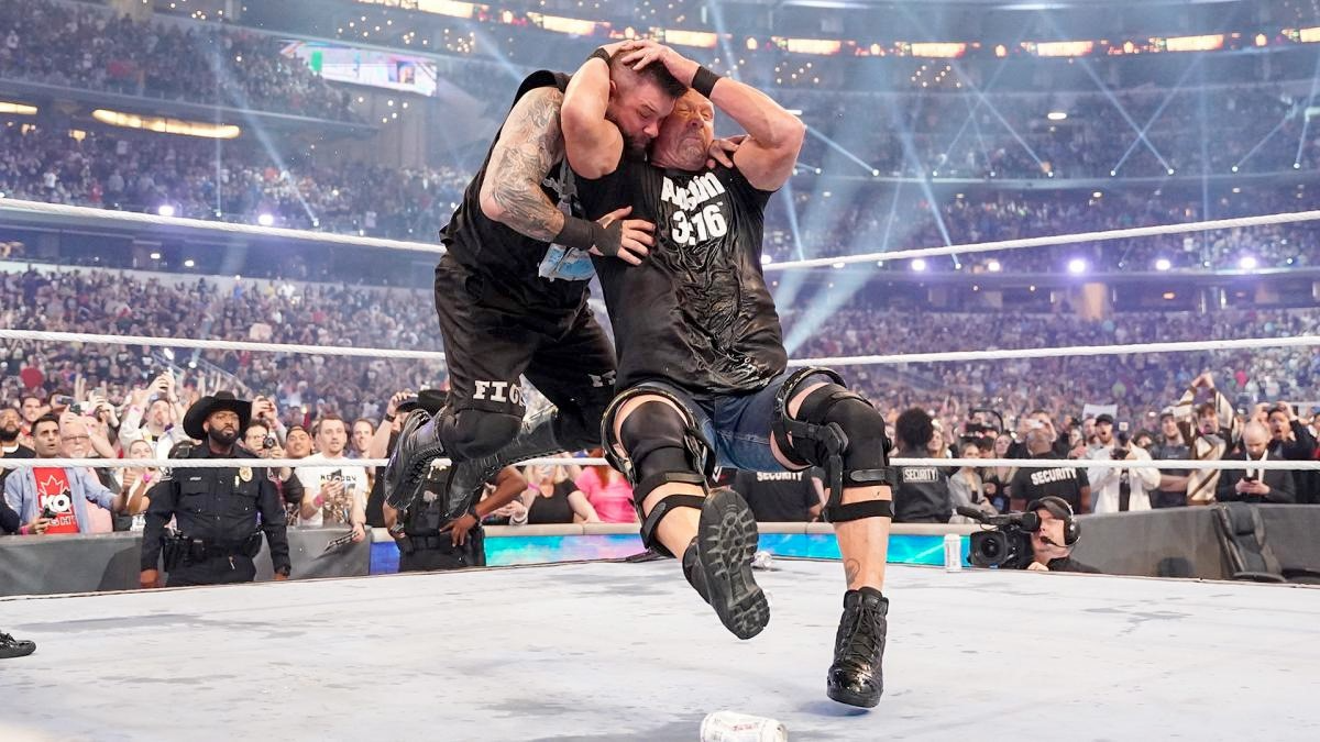 Stone Cold Steve Austin performing his signature move the stone cold stunner at age 57 at WrestleMania 38