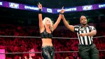 AEW wrestler Toni Storm raises her hands in victory