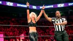 AEW woman wrestler Toni Storm hands raised in victory