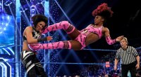 Naomi drop kicking her opponent