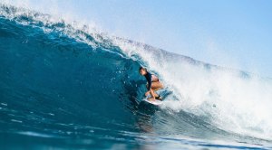 Female Surfer Brisa Hennessy riding in a barrell at the Hawaii Rip Curl