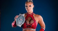 Pro Wrestler Kamille holding a wrestling belt