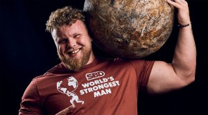 Scotland's World Strongest Man winner Tom Stoltman holding an atlas stone