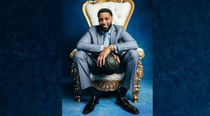 Former NBA Basketball hall of famer Tracy McGrady sitting on a throne with a basketball