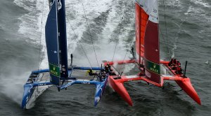 SailGP skipper Jimmy Spithill neck and neck with a competitor in a high speed catamaran race