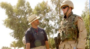 Captain Mike Erwin talking with a translator in Iraq