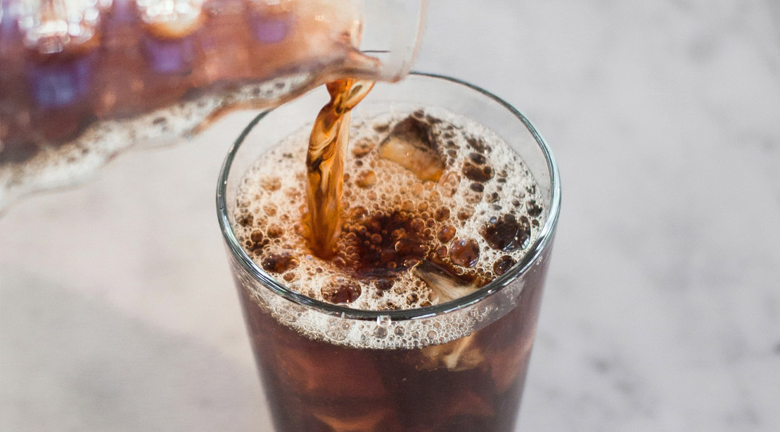 https://www.muscleandfitness.com/wp-content/uploads/2022/08/Cold-brew-coffee-being-poured-into-a-cup-of-ice.jpg?w=1109&h=614&crop=1&quality=86&strip=all