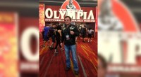 Dr. Klatz posing in front of the Mr. Olympia weekend event