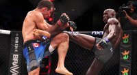 MMA fighter for the PFL Sadibou Sy throwing a body kick to his opponent