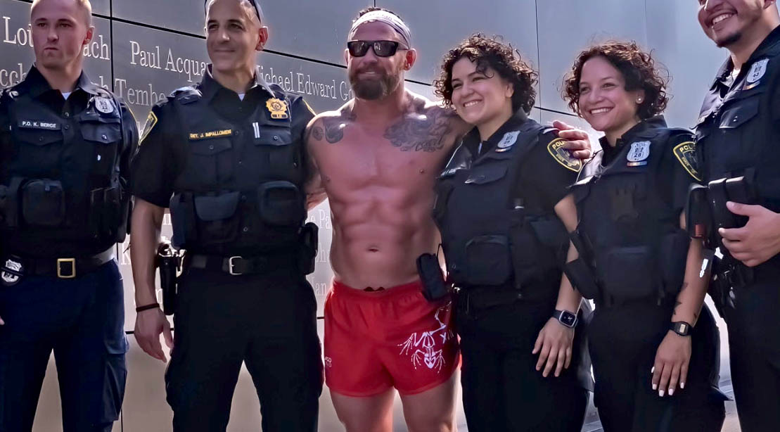 Navy Seal Ray Care posing with police officers