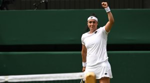 Ons Jabeur celebrating with a fist in the air at Wimbledon