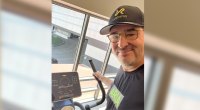 Poker player Phil Hellmuth working out on an elliptical machine