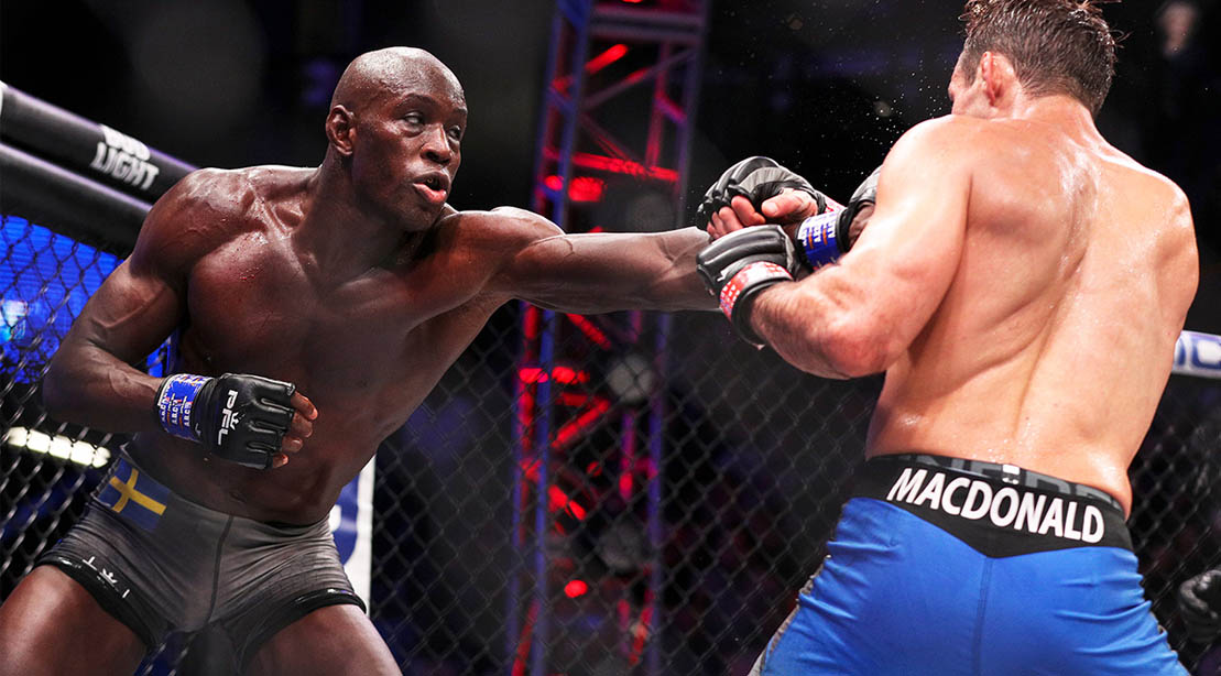 Professional fighter league and MMA fighter Sadibou Sy in the octagon fighting MacDonald