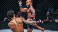 MMA fighter Demetrious Johnson throwing a body kick to his opponent