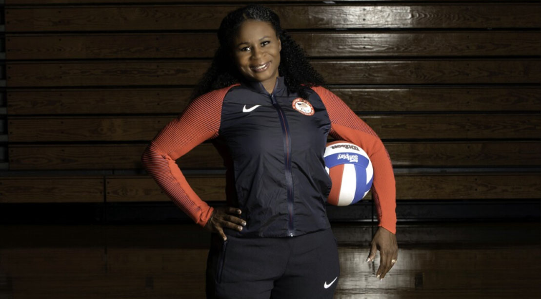 Army veteran Kari Miller-Ortiz holding a volleyball