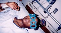 Army veteran Kari Miller-Ortiz laying in a hospital bed