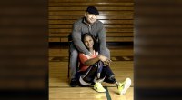 Army veteran Kari Miller-Ortiz with her husband on the basketball court